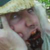 A victim (Ryan Dalton) feels the wrath of Terrible Tommy in Cult Cinema's CAMP MURDER!