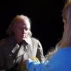 Arianna (Alyssa Paige) shows Officer Dante (Jeff Kirkendall) a possible clue in THE GIRL WHO WORE YELLOW LACE from Polonia Brothers Entertainment and Very Scary Productions.